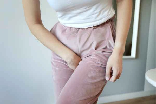 woman running for the toilet because of urinary incontinence Slough